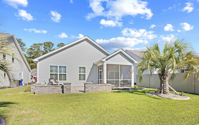 back of property with a sunroom and a patio
