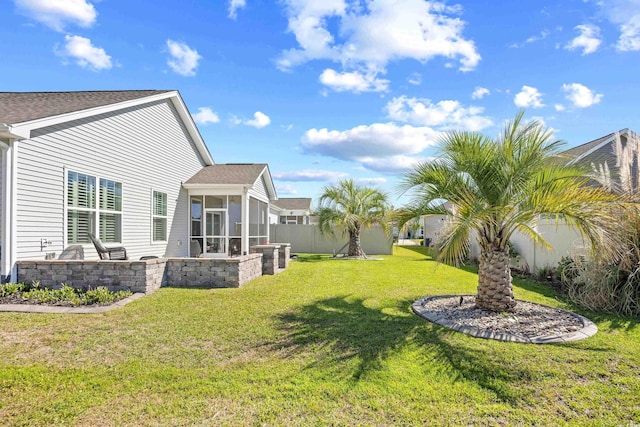 view of yard featuring a sunroom