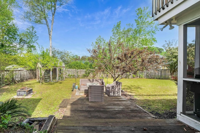 view of yard featuring a fenced backyard and a deck