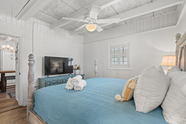 bedroom featuring wood finished floors and a ceiling fan