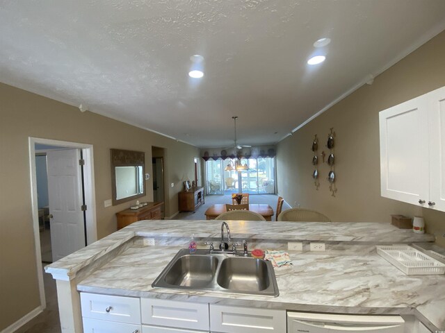 901-9 W Port Dr Unit 907, North Myrtle Beach, SC 29582 - kitchen with a sink, white cabinetry, ornamental molding, recessed lighting, and dishwasher