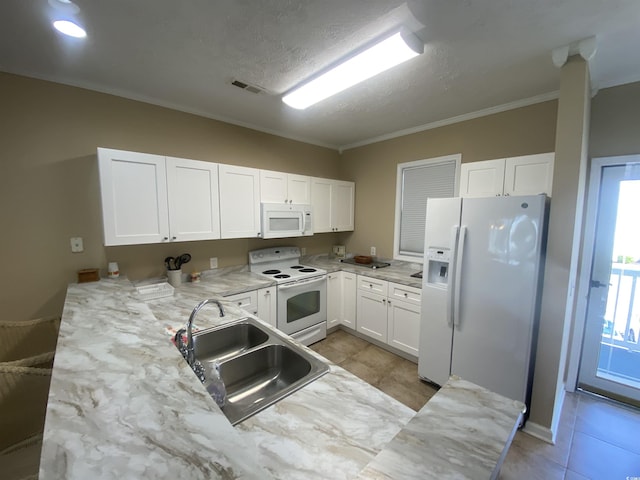 901-9 W Port Dr Unit 907, North Myrtle Beach, SC 29582 - kitchen with white appliances, a sink, crown molding, white cabinets, and light tile patterned flooring