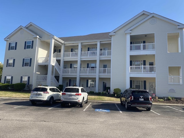 901-9 W Port Dr Unit 907, North Myrtle Beach, SC 29582 - view of building exterior featuring uncovered parking