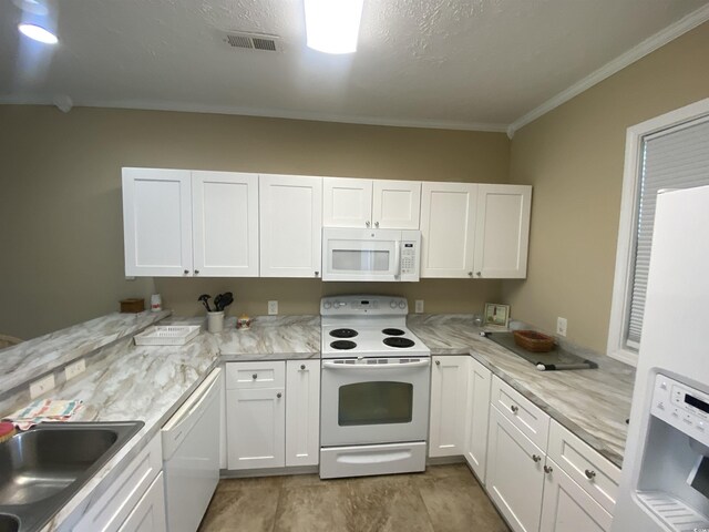 901-9 W Port Dr Unit 907, North Myrtle Beach, SC 29582 - kitchen featuring white appliances, crown molding, white cabinetry, and a peninsula