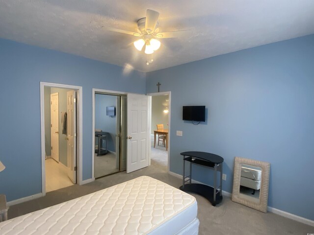 901-9 W Port Dr Unit 907, North Myrtle Beach, SC 29582 - carpeted bedroom featuring a closet, baseboards, and a ceiling fan