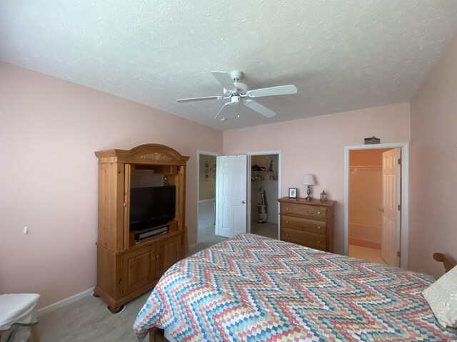 901-9 W Port Dr Unit 907, North Myrtle Beach, SC 29582 - bedroom with light colored carpet, a spacious closet, baseboards, ceiling fan, and a closet
