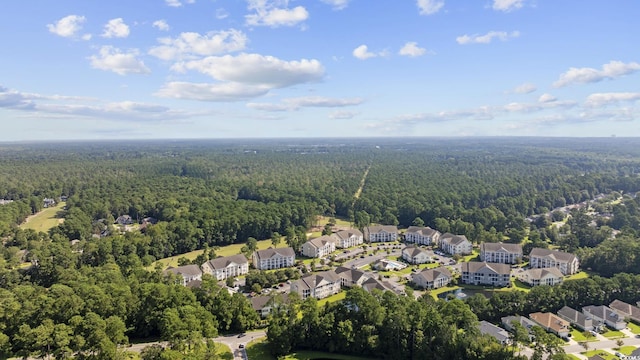 drone / aerial view with a residential view and a view of trees