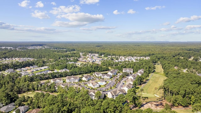 bird's eye view with a wooded view, view of golf course, and a residential view