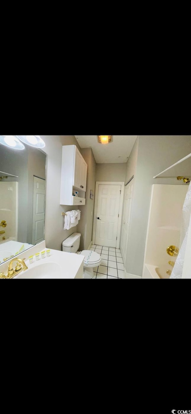 4669 Wild Iris Dr Unit 22-2O2, Myrtle Beach, SC 29577 - bedroom featuring light tile patterned floors and a sink