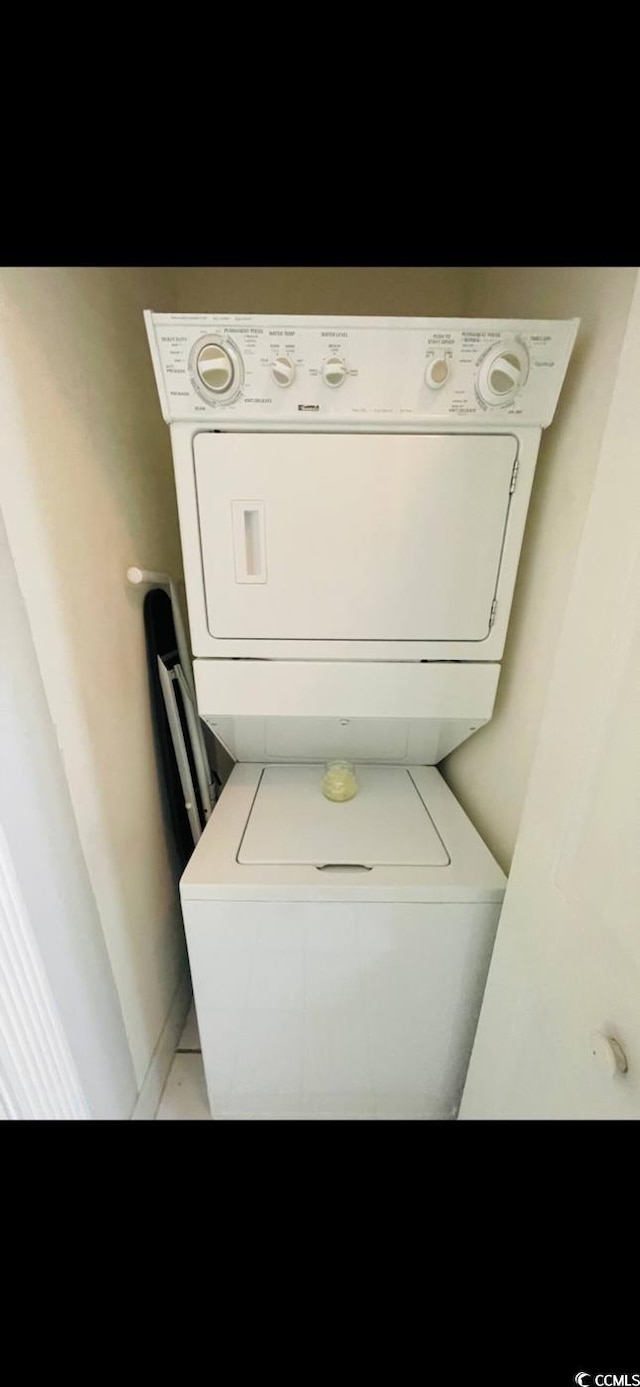 4669 Wild Iris Dr Unit 22-2O2, Myrtle Beach, SC 29577 - laundry room featuring stacked washer and dryer and laundry area
