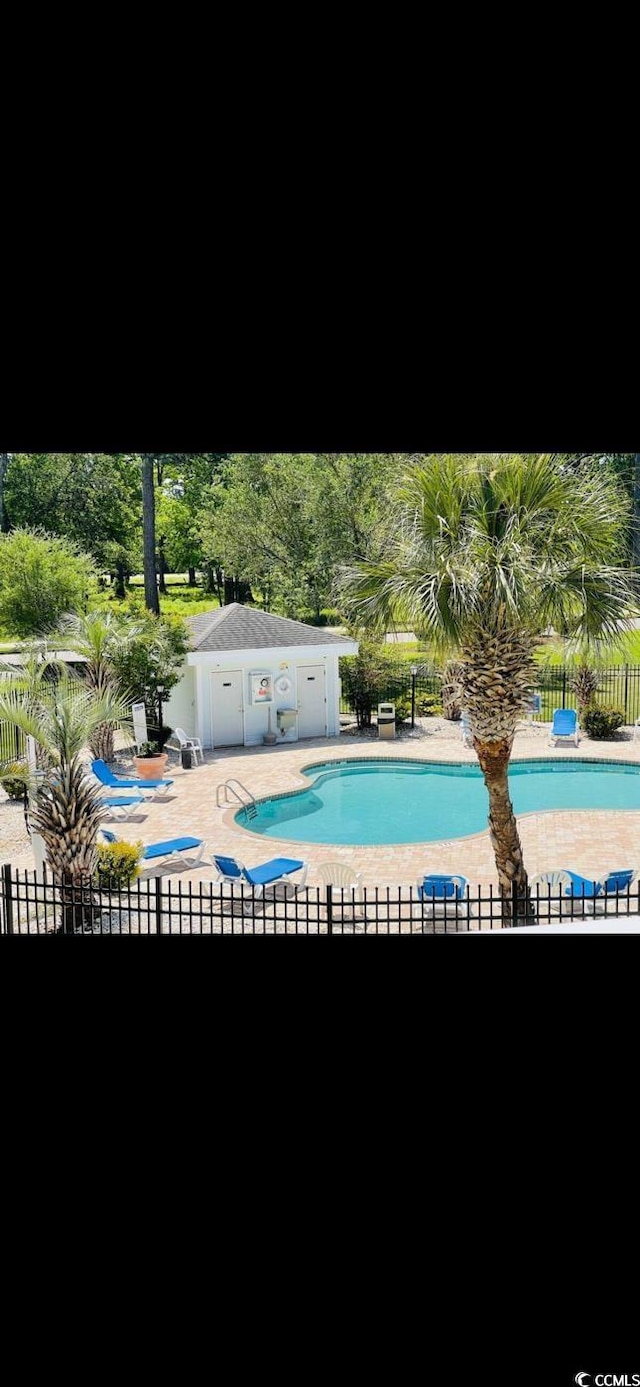 4669 Wild Iris Dr Unit 22-2O2, Myrtle Beach, SC 29577 - pool with a patio and fence