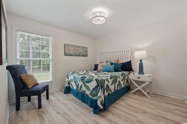 4100 Hagwood Cir, Conway, SC 29526 - bedroom featuring wood finished floors, multiple windows, and baseboards