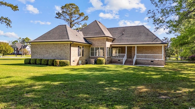 4100 Hagwood Cir, Conway, SC 29526 - back of house with brick siding, a lawn, central AC, a porch, and roof with shingles