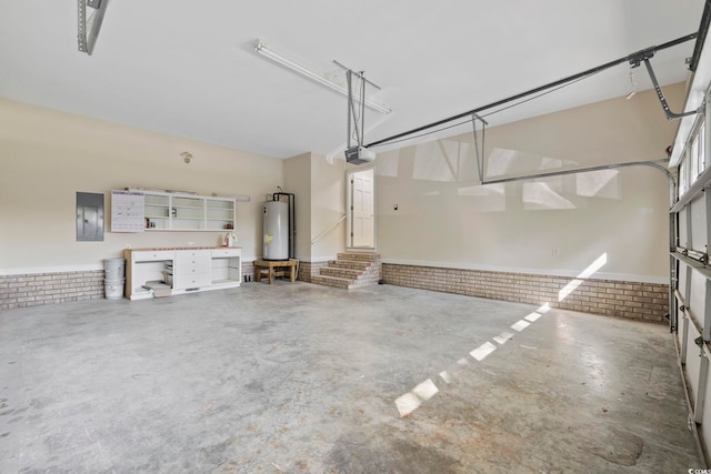 4100 Hagwood Cir, Conway, SC 29526 - garage with water heater, a garage door opener, electric panel, and wainscoting