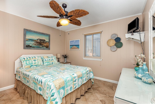 bedroom with crown molding, baseboards, and ceiling fan