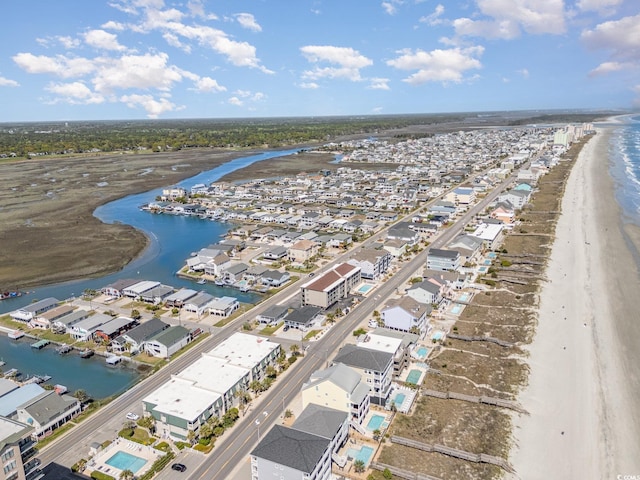 aerial view of residential area featuring a nearby body of water
