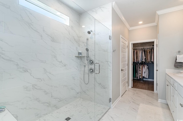 full bathroom featuring a stall shower, ornamental molding, marble finish floor, vanity, and a spacious closet