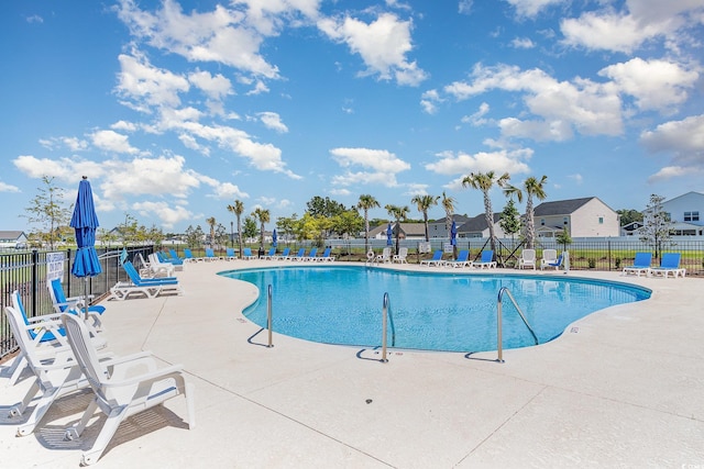pool featuring a patio area and fence