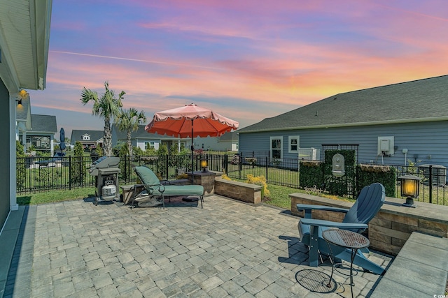 view of patio with fence and area for grilling
