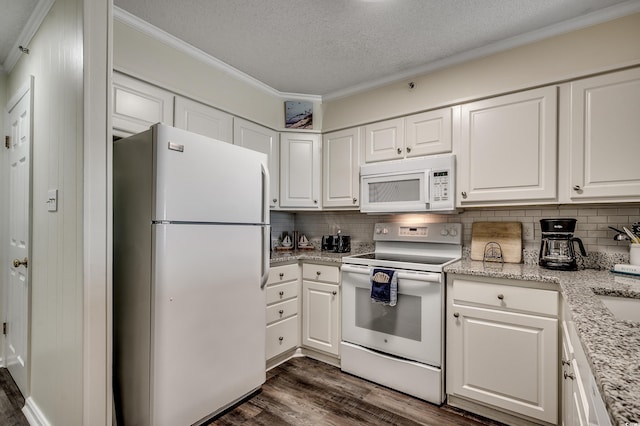 720 N Waccamaw Dr Unit 207, Garden City Beach, SC 29576 - kitchen with dark wood-style flooring, white cabinets, white appliances, and crown molding