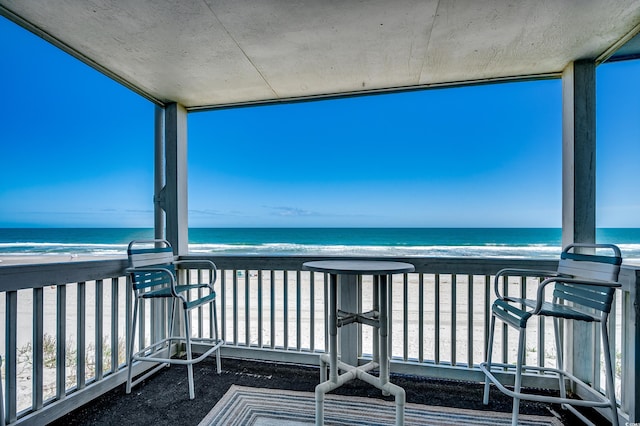 720 N Waccamaw Dr Unit 207, Garden City Beach, SC 29576 - balcony featuring a water view and a beach view