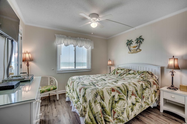 720 N Waccamaw Dr Unit 207, Garden City Beach, SC 29576 - bedroom with a textured ceiling, crown molding, a ceiling fan, and wood finished floors