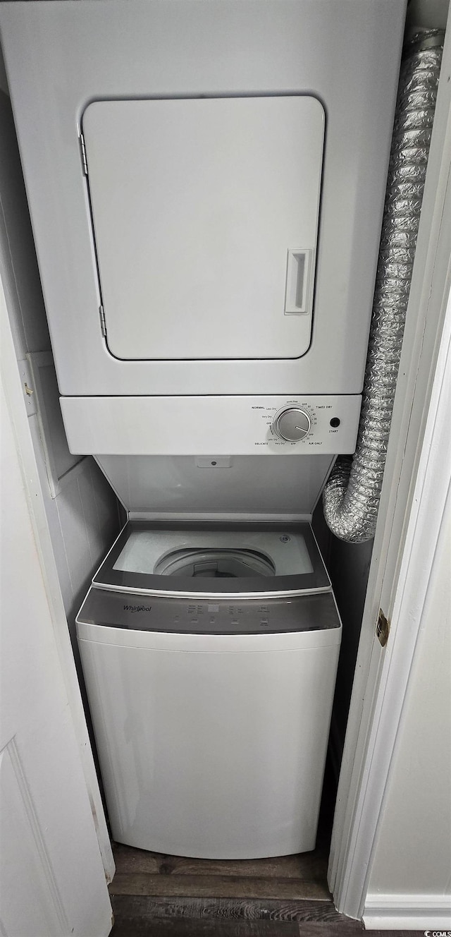 720 N Waccamaw Dr Unit 207, Garden City Beach, SC 29576 - laundry room with laundry area, dark wood-style floors, and stacked washer / drying machine