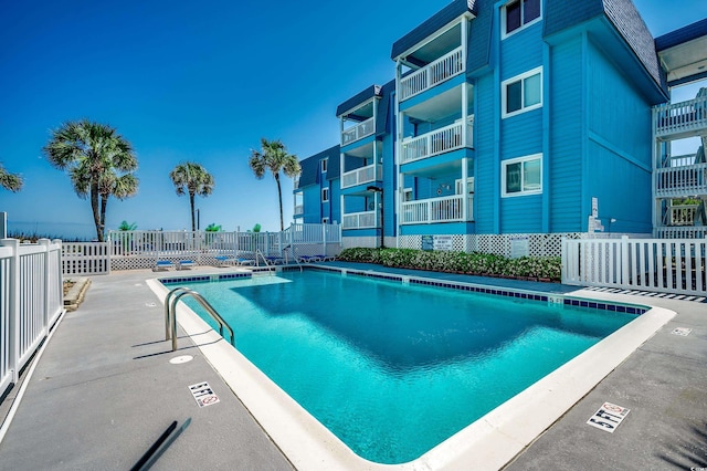 720 N Waccamaw Dr Unit 207, Garden City Beach, SC 29576 - pool featuring a patio area and fence