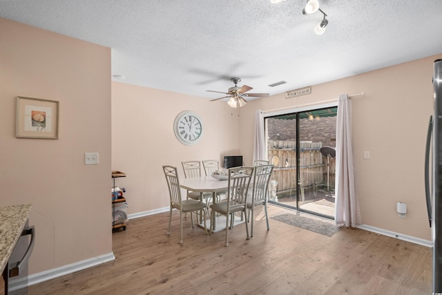 707 S 26th Ave S Unit L, North Myrtle Beach, SC 29582 - dining room with a ceiling fan, a textured ceiling, wood finished floors, and baseboards