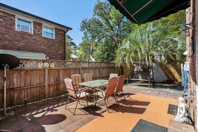 707 S 26th Ave S Unit L, North Myrtle Beach, SC 29582 - fenced backyard with a patio and outdoor dining area
