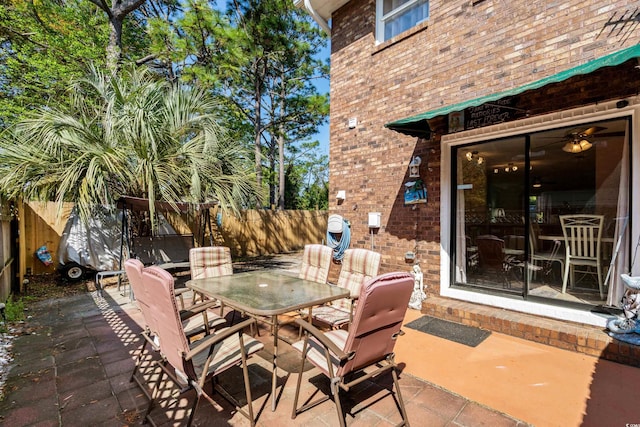 707 S 26th Ave S Unit L, North Myrtle Beach, SC 29582 - fenced backyard featuring outdoor dining space and a patio