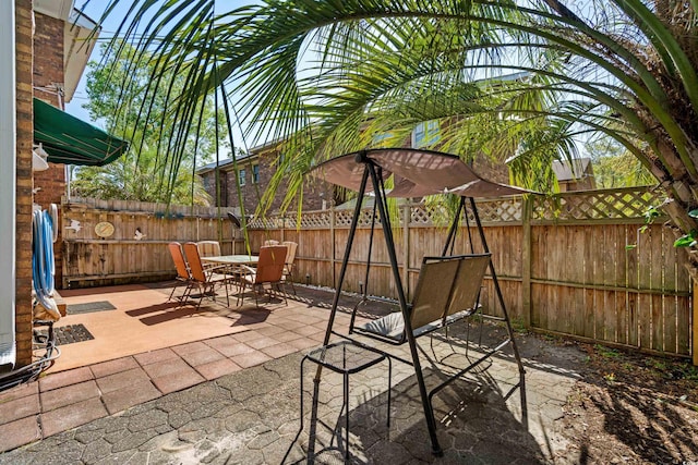 707 S 26th Ave S Unit L, North Myrtle Beach, SC 29582 - fenced backyard with outdoor dining area and a patio area