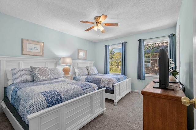 707 S 26th Ave S Unit L, North Myrtle Beach, SC 29582 - bedroom with carpet flooring, ceiling fan, and a textured ceiling