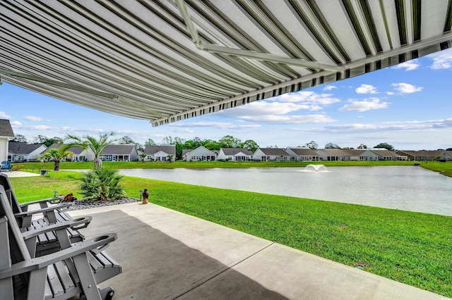 view of patio featuring a water view and a residential view