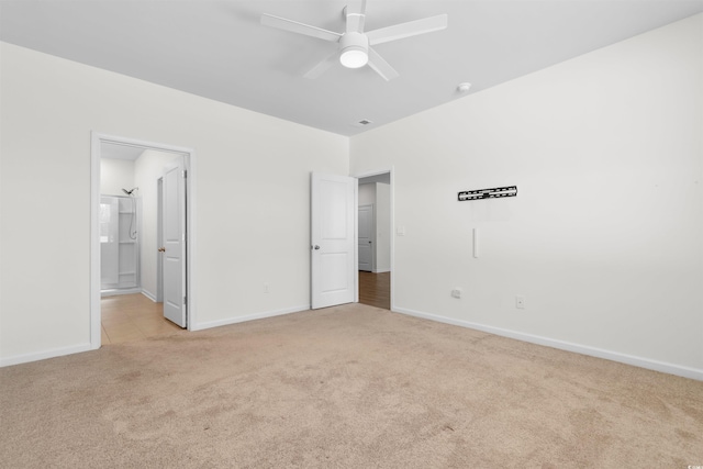 591 Meadowgrass Ct, Myrtle Beach, SC 29588 - unfurnished bedroom featuring ceiling fan, baseboards, light colored carpet, and ensuite bathroom