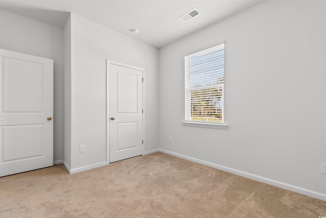 591 Meadowgrass Ct, Myrtle Beach, SC 29588 - unfurnished bedroom with light carpet, visible vents, and baseboards