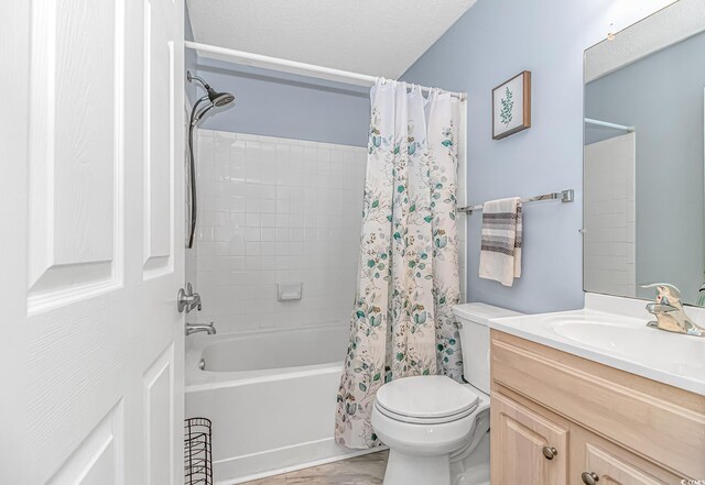 full bathroom with shower / bath combo, vanity, and toilet