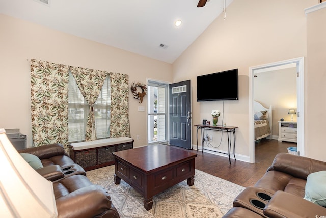 living area with a ceiling fan, wood finished floors, high vaulted ceiling, baseboards, and recessed lighting
