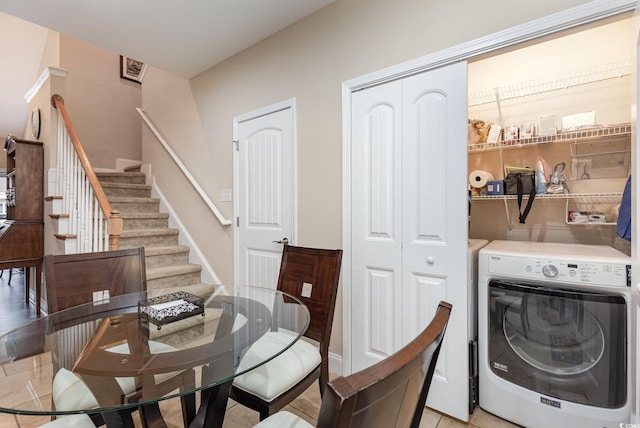 dining room with separate washer and dryer and stairs