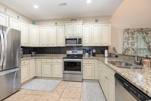 kitchen with visible vents, recessed lighting, a sink, appliances with stainless steel finishes, and backsplash