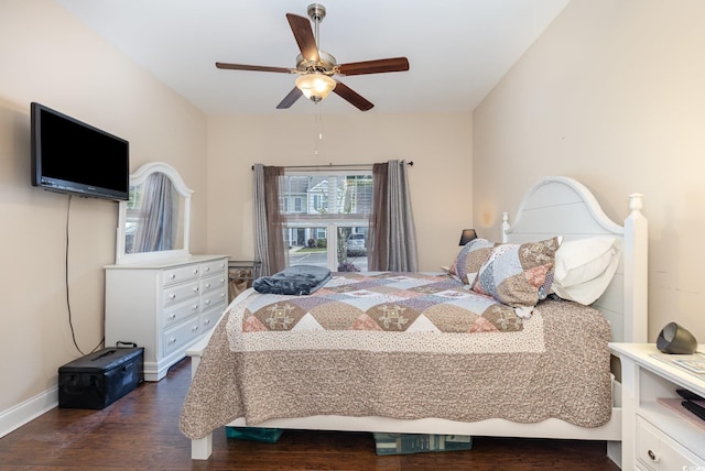 bedroom featuring ceiling fan, dark wood-style floors, and baseboards