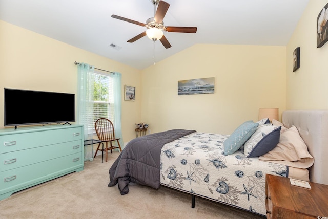 bedroom with visible vents, ceiling fan, lofted ceiling, and light carpet