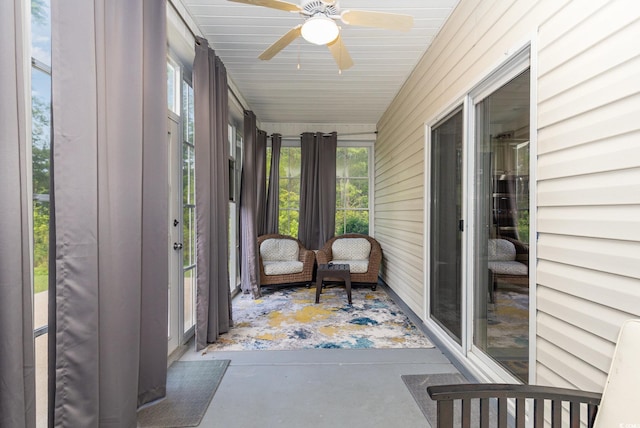 sunroom / solarium with plenty of natural light and a ceiling fan
