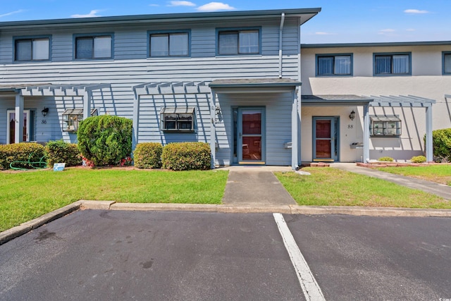 775 Plantation Dr Unit 87, Little River, SC 29566 - view of front of property with a front yard and uncovered parking