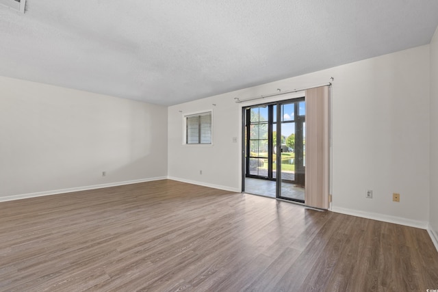 775 Plantation Dr Unit 87, Little River, SC 29566 - empty room featuring a textured ceiling and wood finished floors