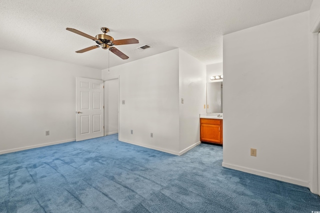 775 Plantation Dr Unit 87, Little River, SC 29566 - unfurnished bedroom with light carpet, ensuite bathroom, a textured ceiling, and ceiling fan