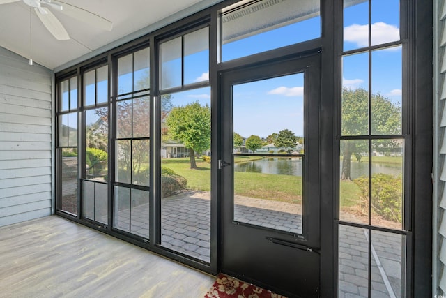 775 Plantation Dr Unit 87, Little River, SC 29566 - doorway to outside with a water view, a ceiling fan, wood finished floors, and wooden walls