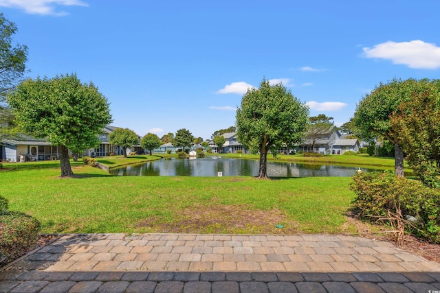 775 Plantation Dr Unit 87, Little River, SC 29566 - view of green lawn featuring a residential view and a water view