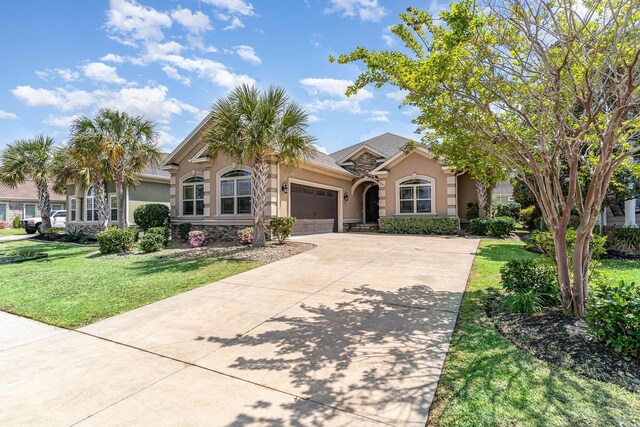 7041 Turtle Cove Dr, Myrtle Beach, SC 29579 - view of front of property with stucco siding, an attached garage, concrete driveway, and a front yard