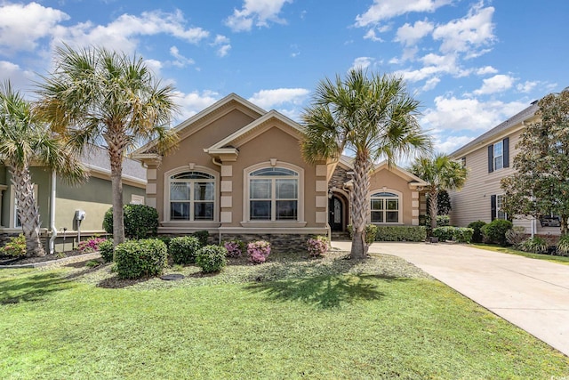 7041 Turtle Cove Dr, Myrtle Beach, SC 29579 - mediterranean / spanish-style home with stucco siding and a front yard